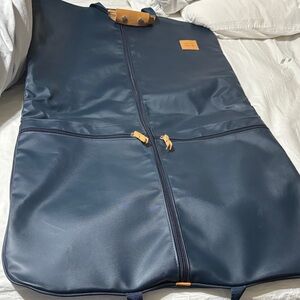 Jon Hart Design navy blue/teal garment bag. Preowned but never used.